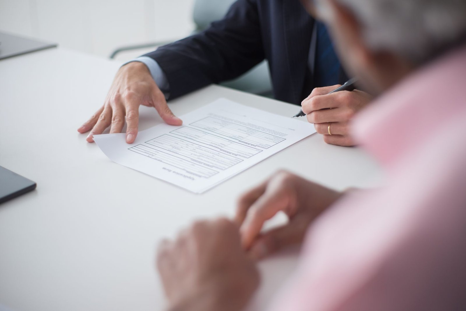 Two professionals signing a consulting agreement